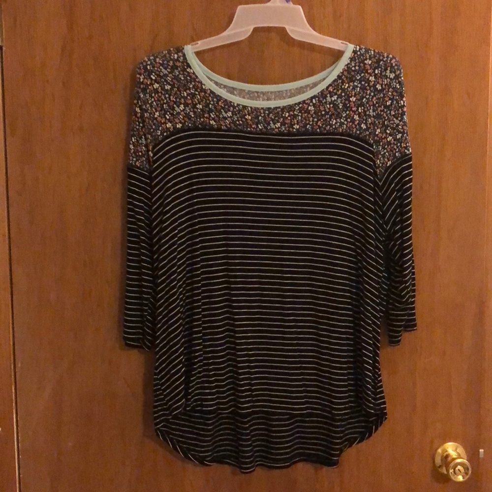 Floral and striped blouse.